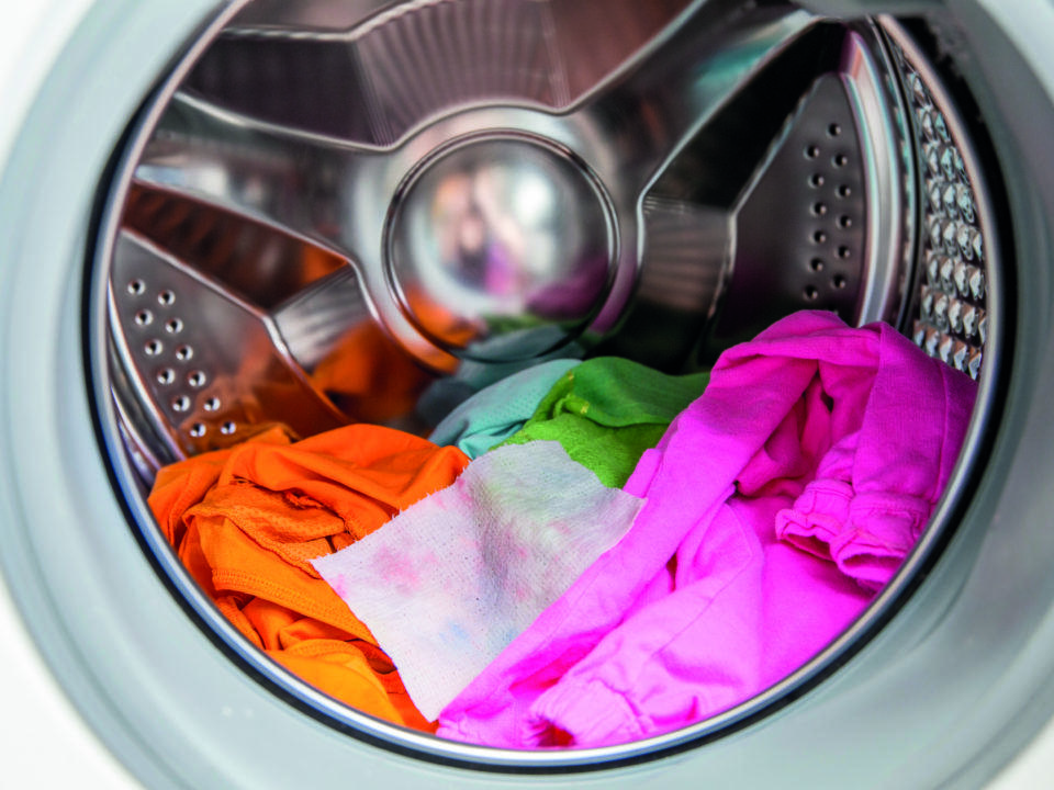 clothes in the dryer with dryer sheet